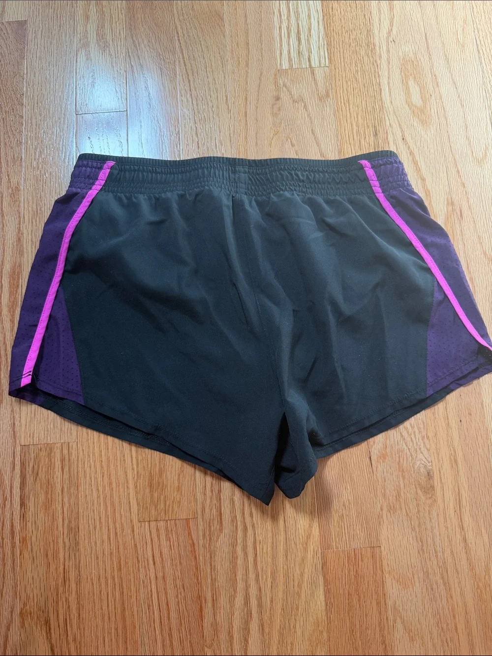 Nike Women's Black Athletic Shorts with Purple Side Panels